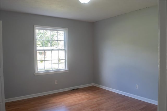 unfurnished room featuring light hardwood / wood-style flooring