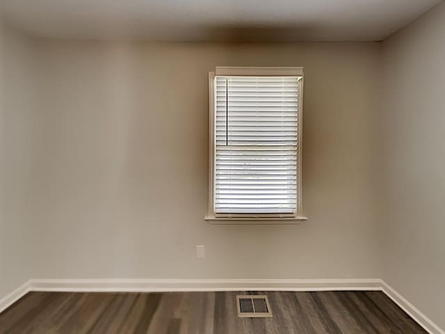 365 Wesley Mill Pl, Villa Rica, GA 30180 - empty room featuring dark wood-type flooring and baseboards