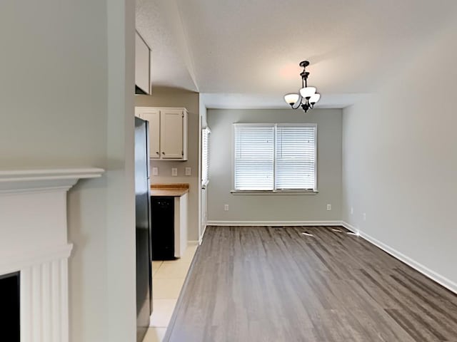 365 Wesley Mill Pl, Villa Rica, GA 30180 - unfurnished dining area with a chandelier and light wood-type flooring