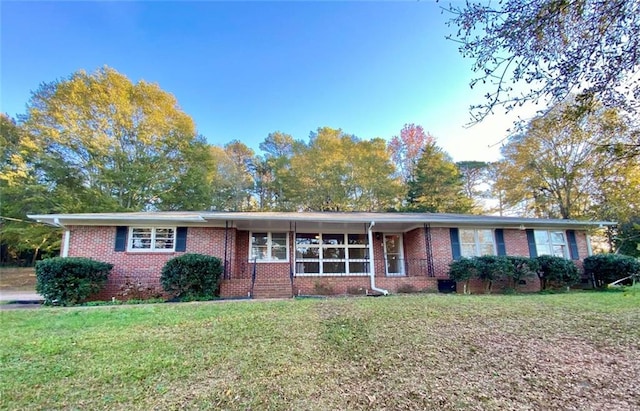 ranch-style house with a front lawn