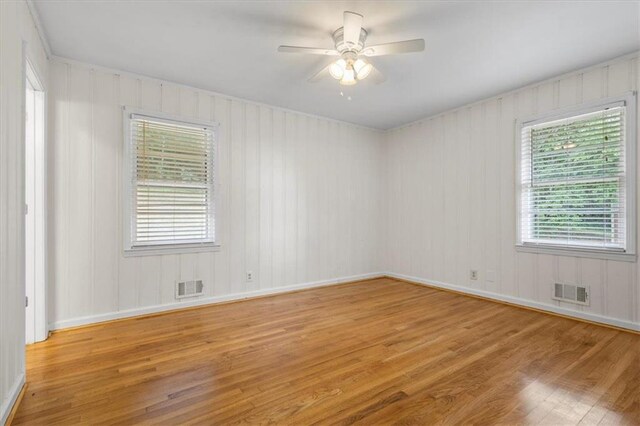 unfurnished room with ceiling fan and light hardwood / wood-style flooring