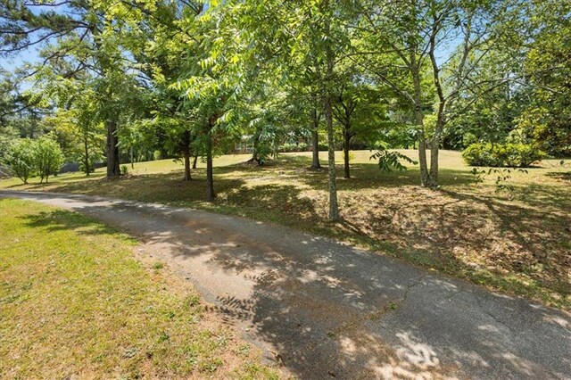 surrounding community featuring a lawn