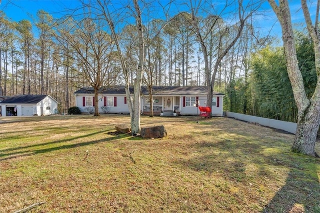 ranch-style home featuring a front yard and covered porch