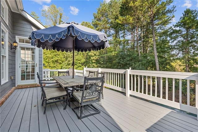 deck featuring outdoor dining area