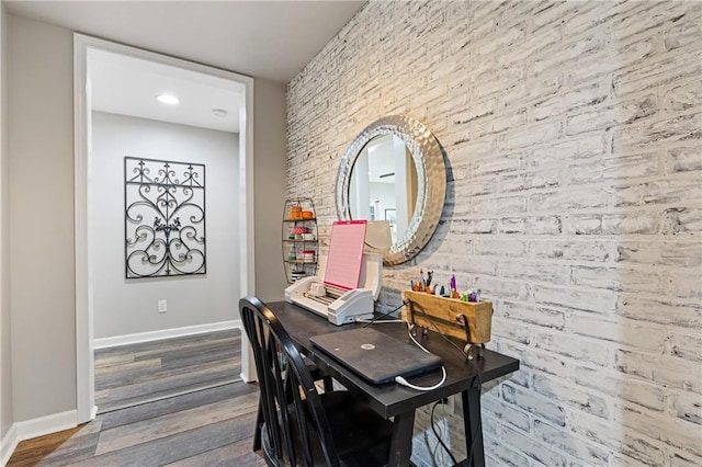 dining room featuring baseboards and wood finished floors