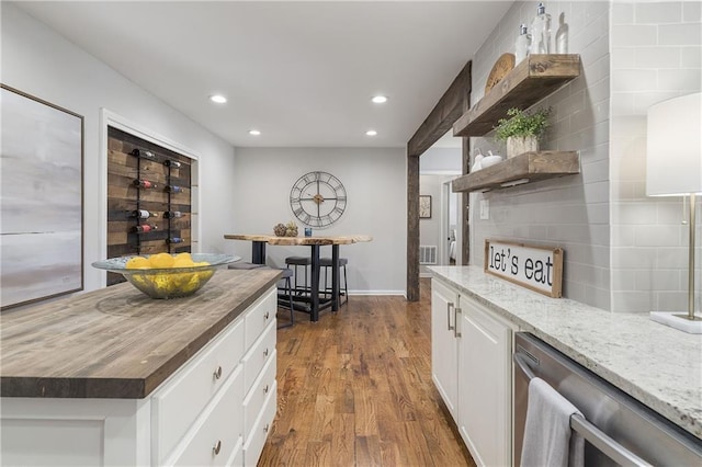 kitchen featuring stainless steel dishwasher, dark wood finished floors, open shelves, white cabinets, and recessed lighting