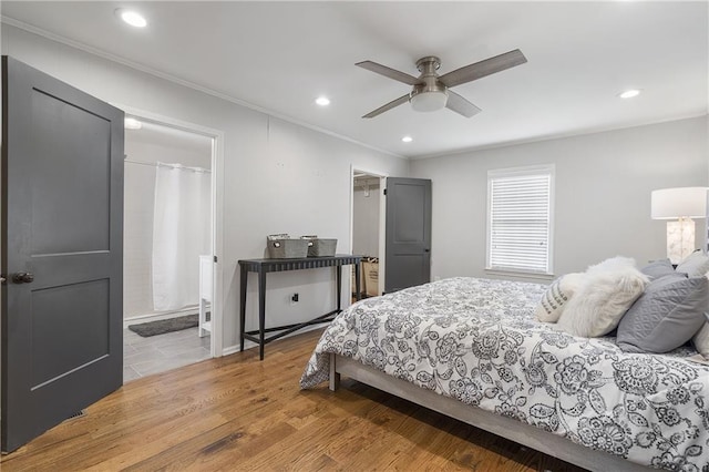 bedroom featuring recessed lighting, ornamental molding, and wood finished floors