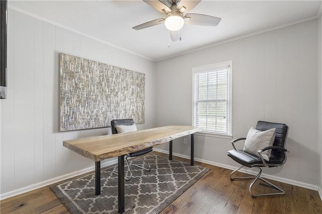 office featuring ceiling fan, baseboards, crown molding, and wood finished floors