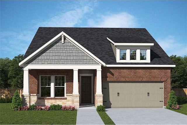 craftsman-style house featuring a garage and a front yard