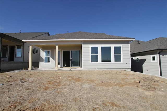 rear view of house with a patio