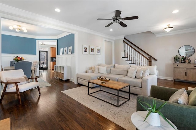 living room with dark wood-style floors, recessed lighting, a wainscoted wall, and crown molding