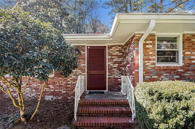 entrance to property with brick siding