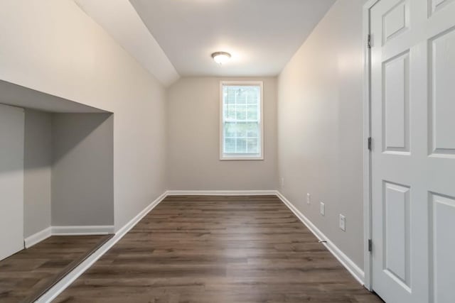 210 Riveredge Way, Mcdonough, GA 30252 - bonus room with vaulted ceiling, dark wood-type flooring, and baseboards