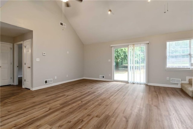 210 Riveredge Way, Mcdonough, GA 30252 - unfurnished living room featuring lofted ceiling, wood finished floors, baseboards, and ceiling fan