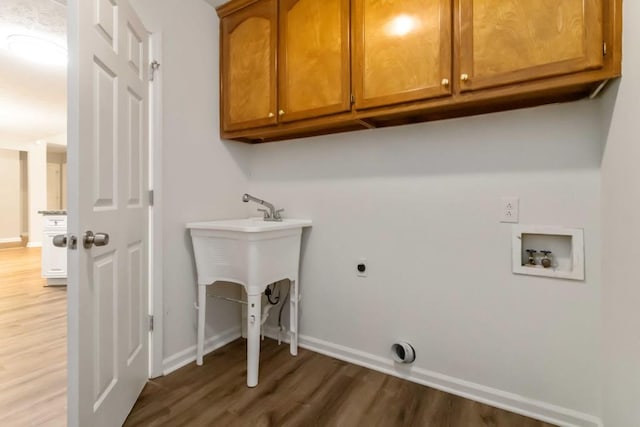 210 Riveredge Way, Mcdonough, GA 30252 - laundry room with cabinet space, hookup for a washing machine, wood finished floors, electric dryer hookup, and baseboards