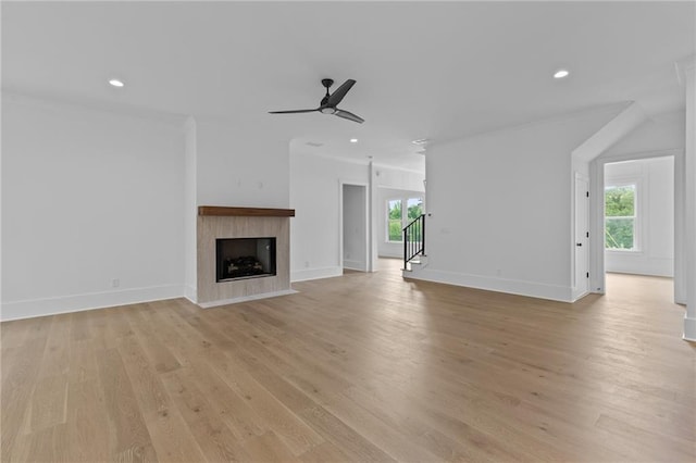 6120 Hutchins Dr, Buford, GA 30518 - unfurnished living room featuring plenty of natural light, a ceiling fan, light wood-style floors, recessed lighting, and ornamental molding