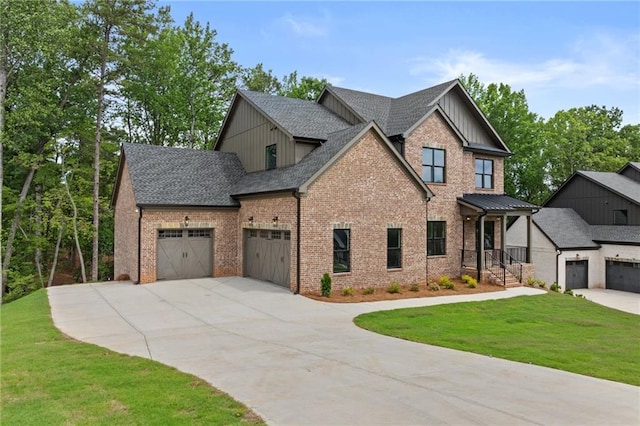 6120 Hutchins Dr, Buford, GA 30518 - craftsman-style home with a front lawn, a garage, concrete driveway, brick siding, and roof with shingles