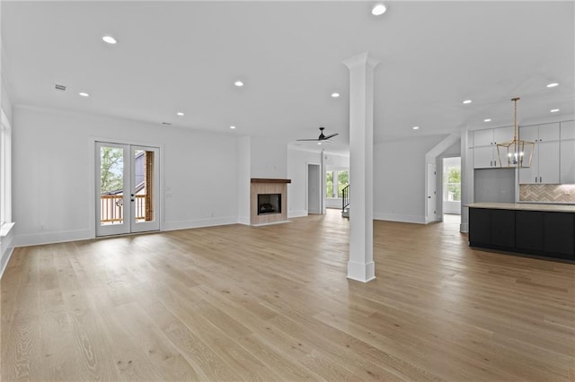 6120 Hutchins Dr, Buford, GA 30518 - unfurnished living room with recessed lighting, plenty of natural light, a tile fireplace, ceiling fan, and baseboards