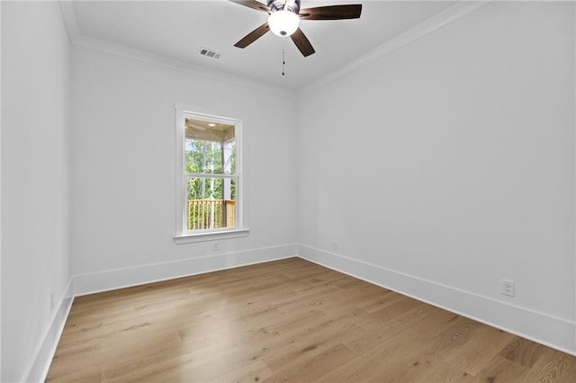 6120 Hutchins Dr, Buford, GA 30518 - spare room featuring ornamental molding, light wood-style floors, ceiling fan, and baseboards