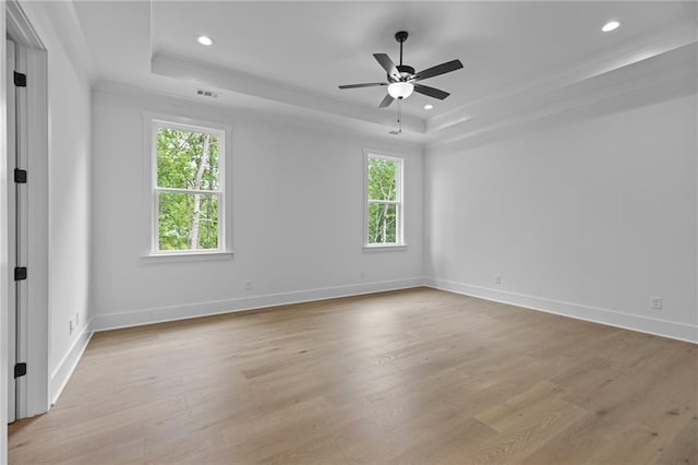 6120 Hutchins Dr, Buford, GA 30518 - spare room featuring a raised ceiling, plenty of natural light, light wood-style flooring, ornamental molding, and recessed lighting