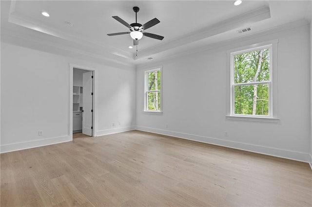 6120 Hutchins Dr, Buford, GA 30518 - empty room with a raised ceiling, ornamental molding, recessed lighting, light wood finished floors, and ceiling fan