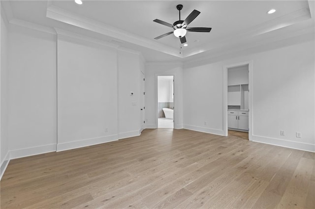 6120 Hutchins Dr, Buford, GA 30518 - unfurnished bedroom featuring a tray ceiling, light wood-type flooring, ornamental molding, recessed lighting, and baseboards