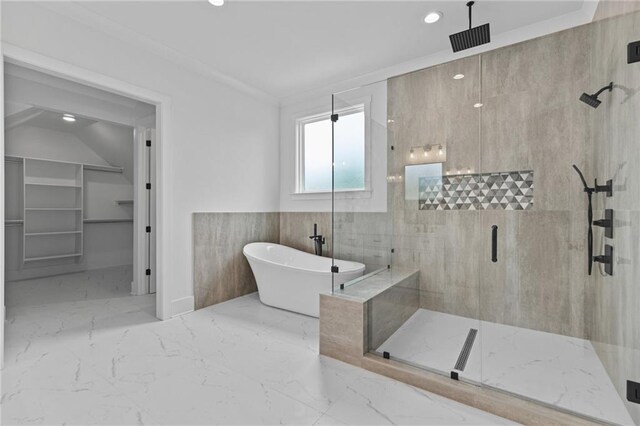 6120 Hutchins Dr, Buford, GA 30518 - bathroom with a marble finish shower, a freestanding tub, marble tiled floors, recessed lighting, and a walk in closet