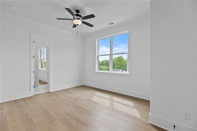 6120 Hutchins Dr, Buford, GA 30518 - spare room featuring crown molding, light wood-style flooring, baseboards, and a ceiling fan