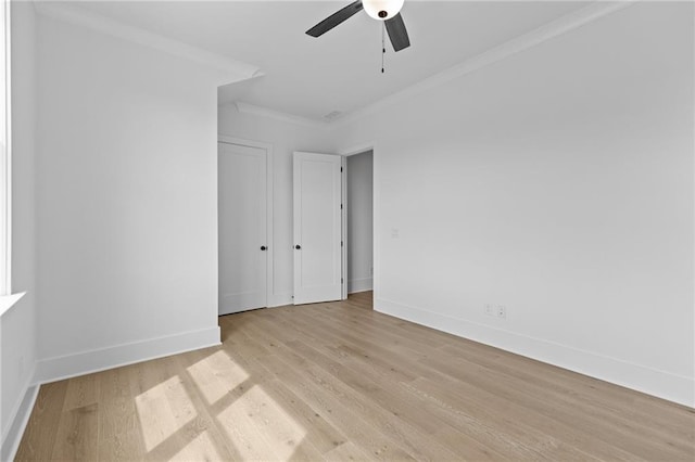 6120 Hutchins Dr, Buford, GA 30518 - empty room featuring ceiling fan, light wood-style flooring, baseboards, and ornamental molding