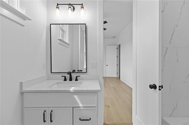 6120 Hutchins Dr, Buford, GA 30518 - bathroom with vanity and wood finished floors