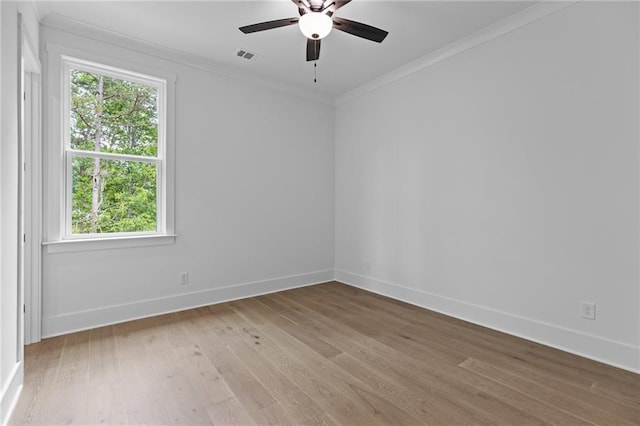 6120 Hutchins Dr, Buford, GA 30518 - spare room featuring light wood-style floors, baseboards, crown molding, and healthy amount of natural light