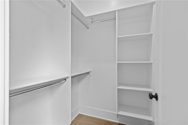 6120 Hutchins Dr, Buford, GA 30518 - spacious closet featuring wood finished floors
