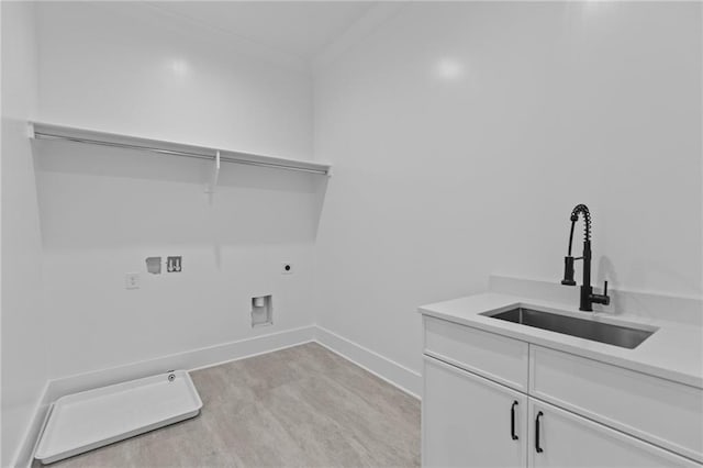 6120 Hutchins Dr, Buford, GA 30518 - laundry room with hookup for a washing machine, cabinet space, electric dryer hookup, baseboards, and gas dryer hookup