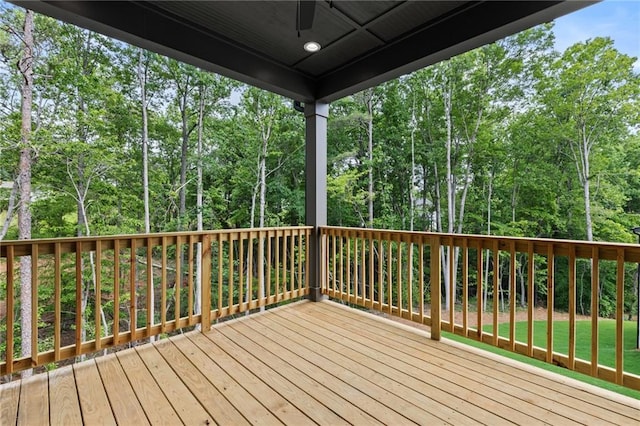 6120 Hutchins Dr, Buford, GA 30518 - wooden deck featuring ceiling fan and view of scattered trees