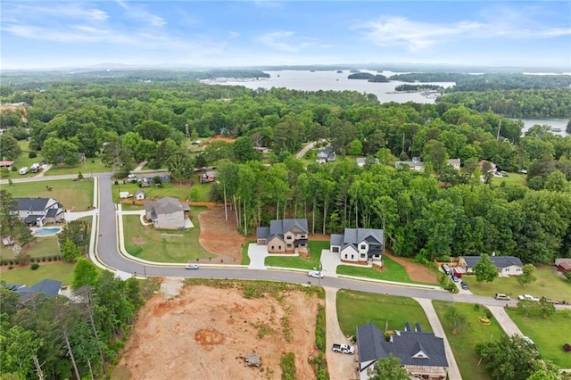 6120 Hutchins Dr, Buford, GA 30518 - drone / aerial view of a nearby body of water and a heavily wooded area