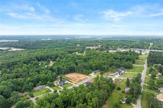 6120 Hutchins Dr, Buford, GA 30518 - aerial overview of property's location with a heavily wooded area