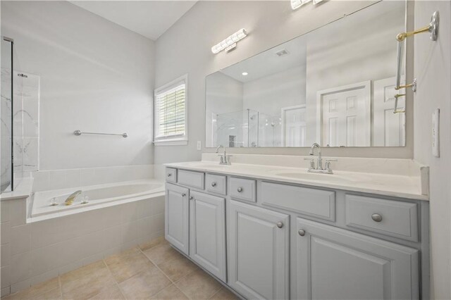 6329 Edgewater Cv, Fairburn, GA 30213 - full bathroom featuring a stall shower, a garden tub, double vanity, and a sink