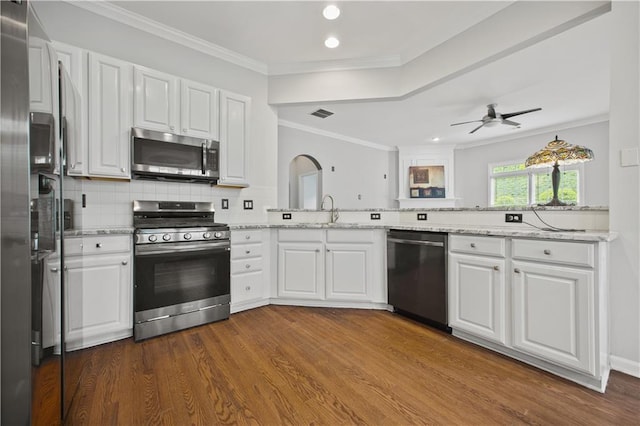 6329 Edgewater Cv, Fairburn, GA 30213 - kitchen with a sink, dark wood-style flooring, appliances with stainless steel finishes, white cabinetry, and recessed lighting