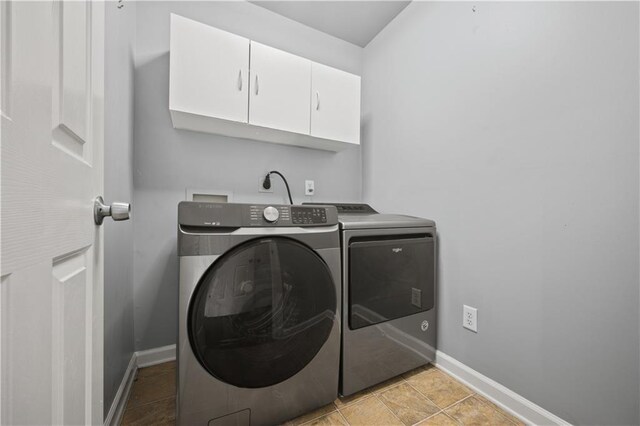 6329 Edgewater Cv, Fairburn, GA 30213 - clothes washing area with cabinet space, washer and clothes dryer, and baseboards