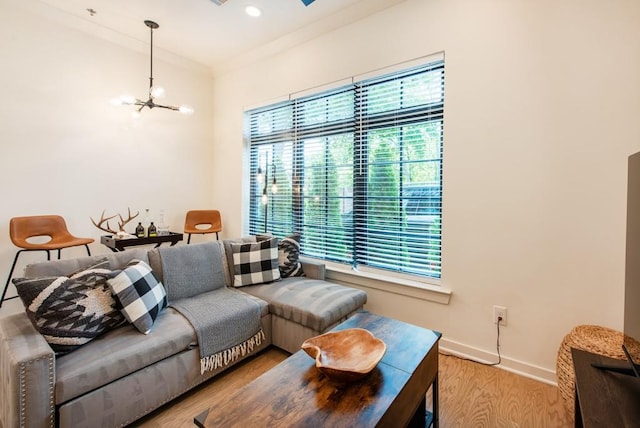 417 E College Ave Unit 102, Decatur, GA 30030 - living area featuring healthy amount of natural light, wood finished floors, a chandelier, and baseboards