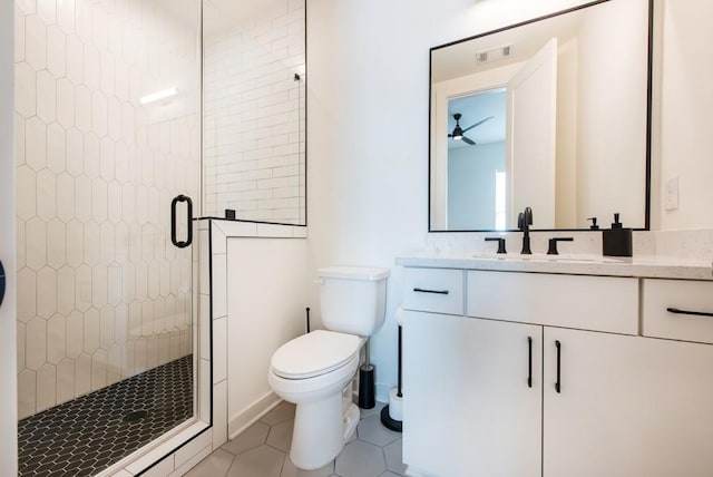 417 E College Ave Unit 102, Decatur, GA 30030 - full bath with a shower stall, tile patterned flooring, a ceiling fan, vanity, and toilet