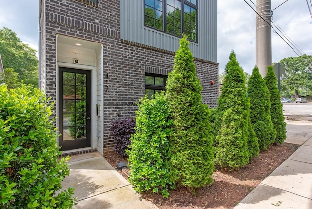 417 E College Ave Unit 102, Decatur, GA 30030 - view of exterior entry with brick siding and board and batten siding
