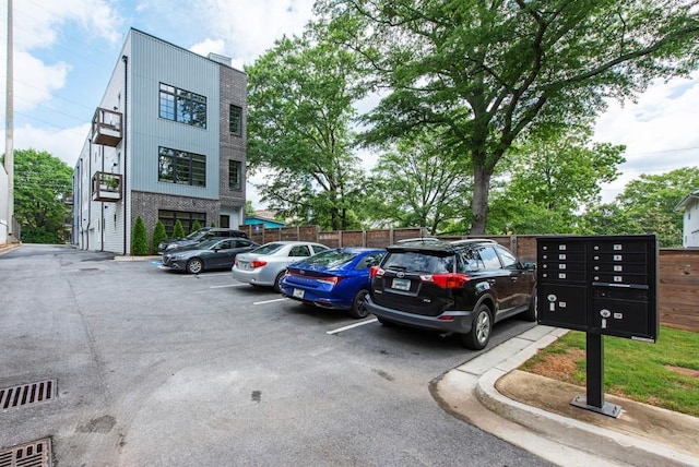 417 E College Ave Unit 102, Decatur, GA 30030 - uncovered parking lot featuring mail area and fence