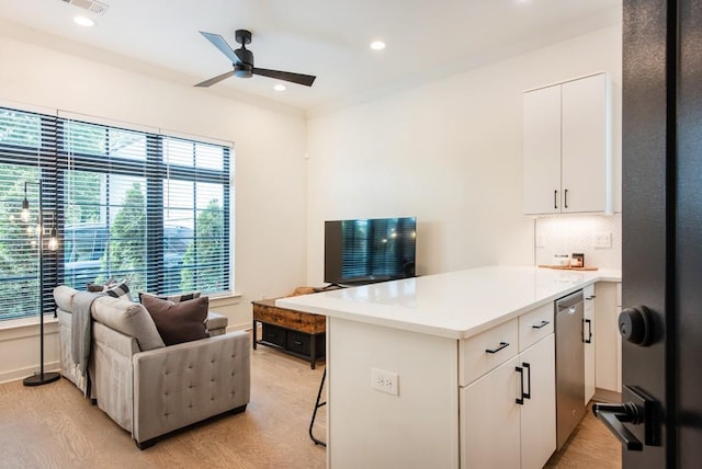417 E College Ave Unit 102, Decatur, GA 30030 - kitchen featuring a peninsula, plenty of natural light, open floor plan, a ceiling fan, and recessed lighting