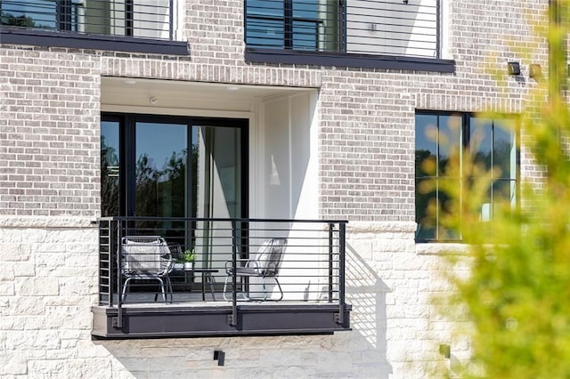 property entrance with brick siding