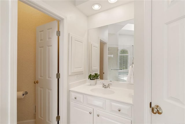 bathroom with vanity and walk in shower