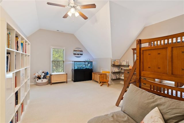 carpeted bedroom featuring ceiling fan, visible vents, and lofted ceiling