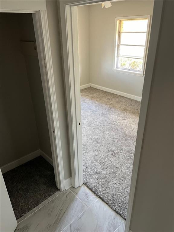 corridor with light carpet