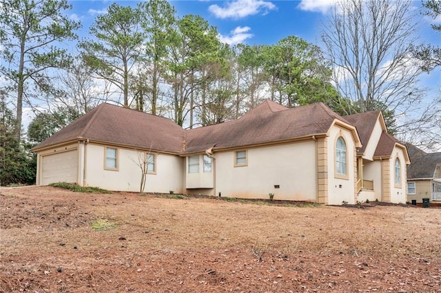 view of side of home featuring a garage