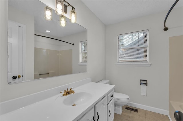 full bathroom featuring tile patterned flooring, vanity, toilet, and shower / washtub combination